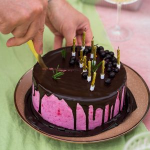 a man cutting cake